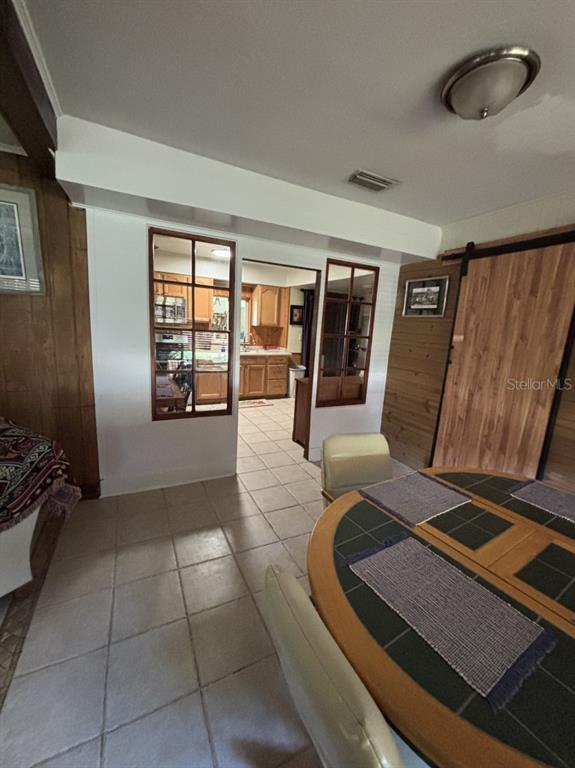 6110 Southwest 13th Street Gainesville, FL 32608 - Photo 3 of 7 a view of work space with wooden floor and windows