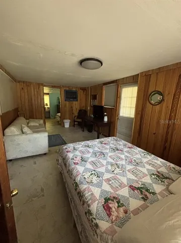 a bedroom with bed and window