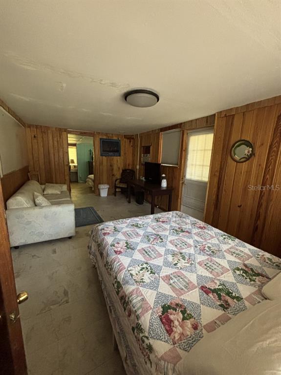6110 Southwest 13th Street Gainesville, FL 32608 - Photo 4 of 7 a bedroom with bed and window
