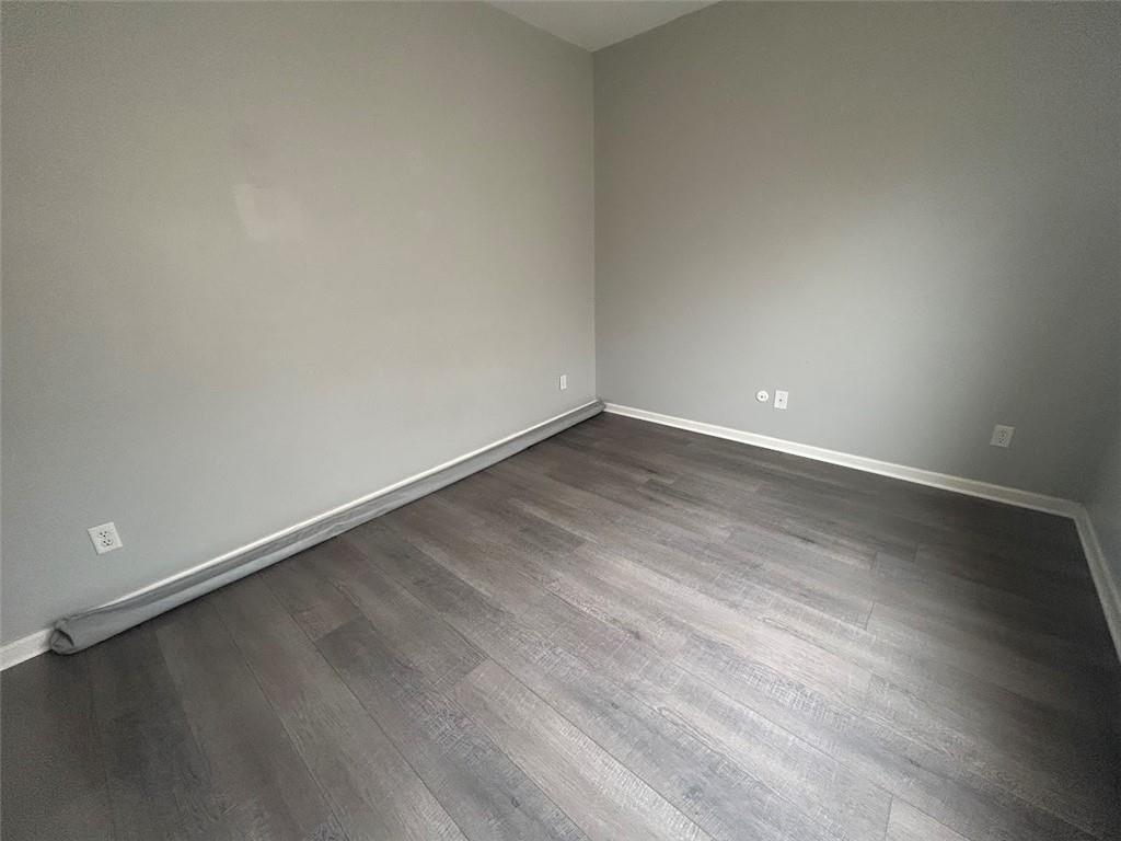 3220 Waterplace Cove Villa Rica, GA 30180 - Photo 18 of 36 a view of an empty room and wooden floor