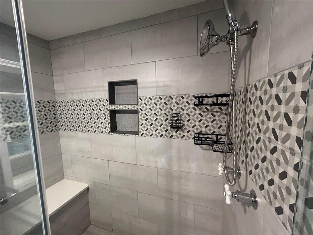 3220 Waterplace Cove Villa Rica, GA 30180 - Photo 21 of 36 a bathroom with a shower