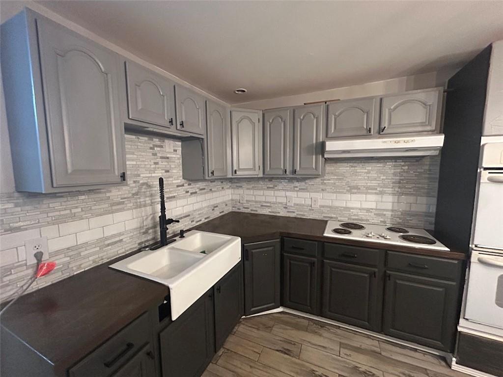 3220 Waterplace Cove Villa Rica, GA 30180 - Photo 25 of 36 a kitchen with a sink cabinets and appliances