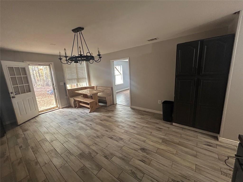 3220 Waterplace Cove Villa Rica, GA 30180 - Photo 26 of 36 a living room with furniture and a wooden floor