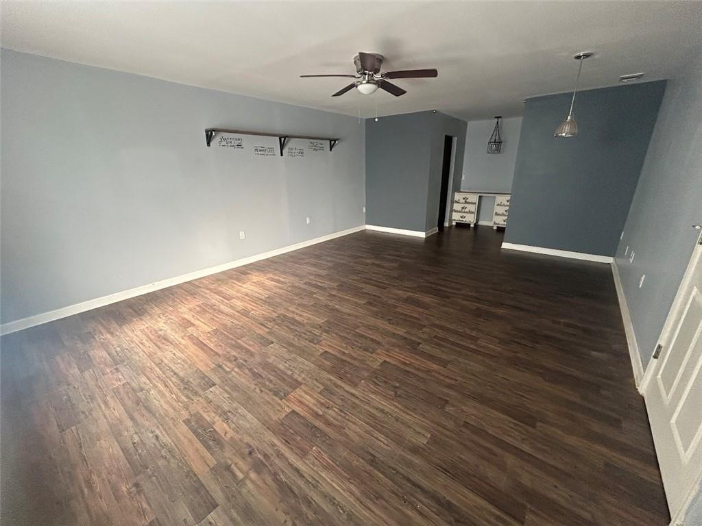 3220 Waterplace Cove Villa Rica, GA 30180 - Photo 27 of 36 a view of an empty room with wooden floor and a window