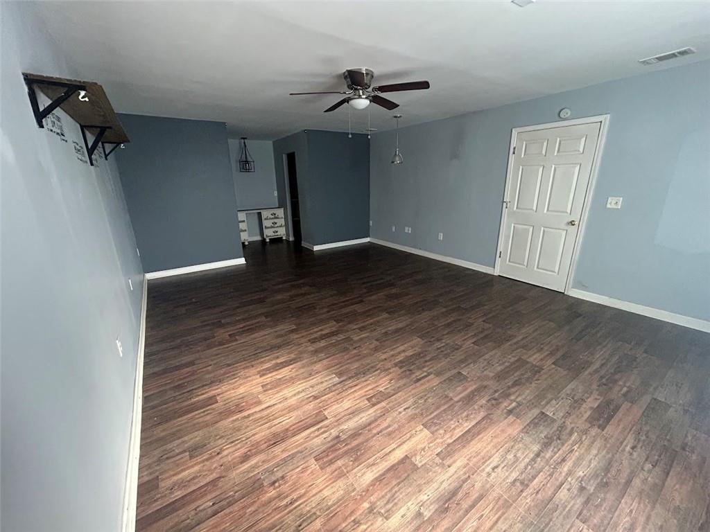 3220 Waterplace Cove Villa Rica, GA 30180 - Photo 28 of 36 a view of a livingroom with a ceiling fan and wooden floor