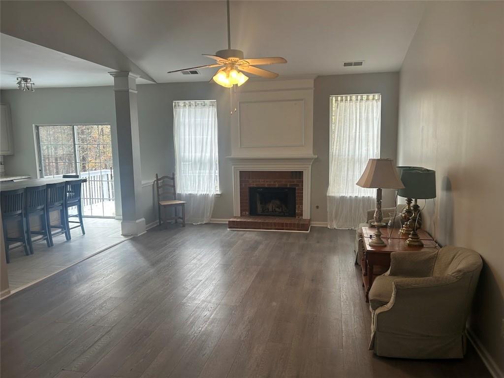 3220 Waterplace Cove Villa Rica, GA 30180 - Photo 4 of 36 a living room with furniture and a fireplace