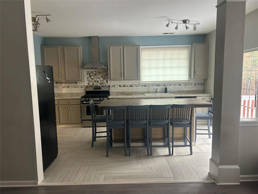 3220 Waterplace Cove Villa Rica, GA 30180 - Photo 5 of 36 a kitchen with stainless steel appliances granite countertop a stove a refrigerator and a granite counter tops