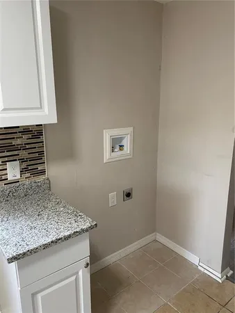 a kitchen with granite countertop cabinets and sink