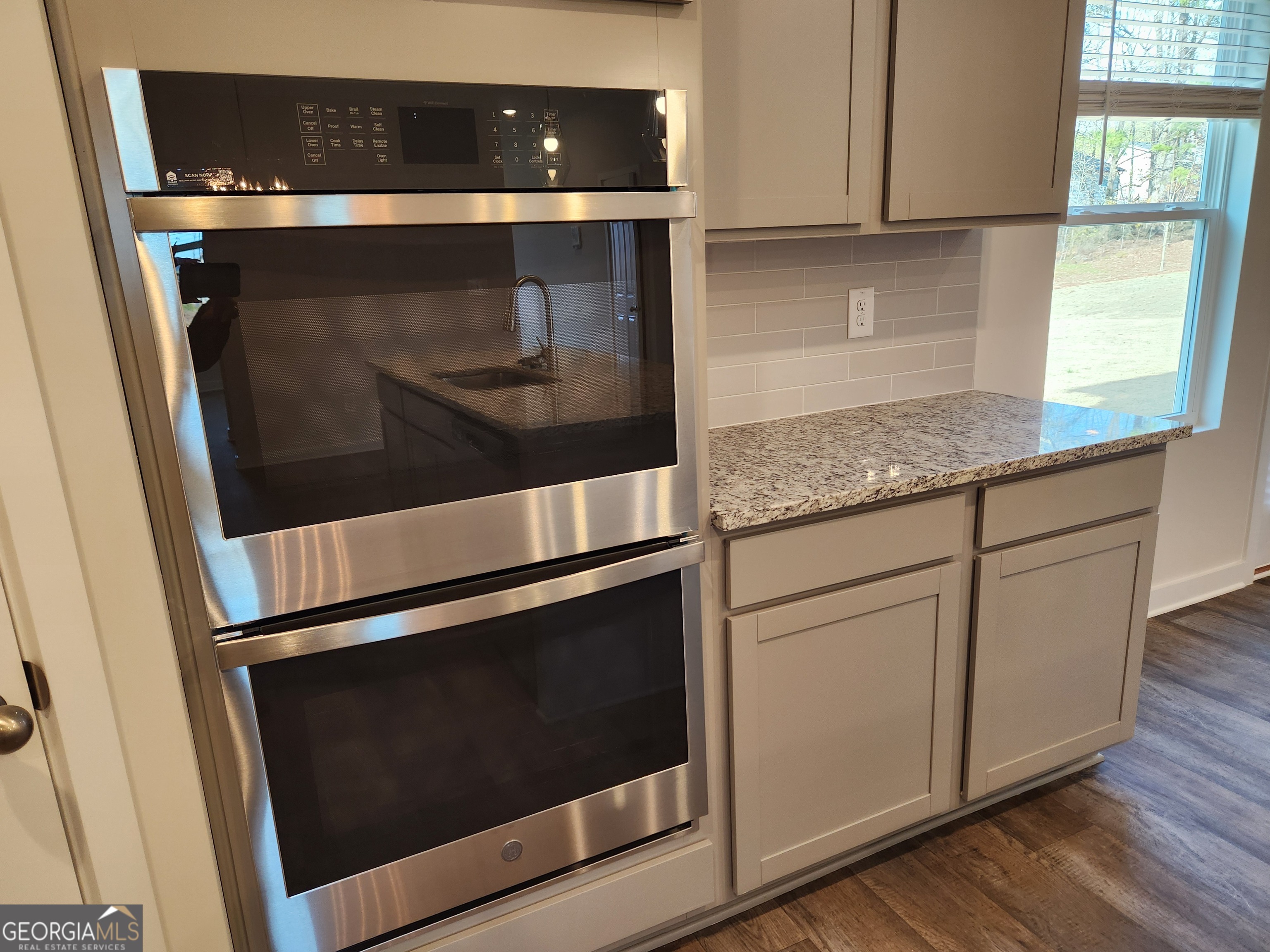 203 Crabapple Road, Unit 265 McDonough, GA 30253 - Photo 15 of 54 a stove top oven sitting inside of a kitchen