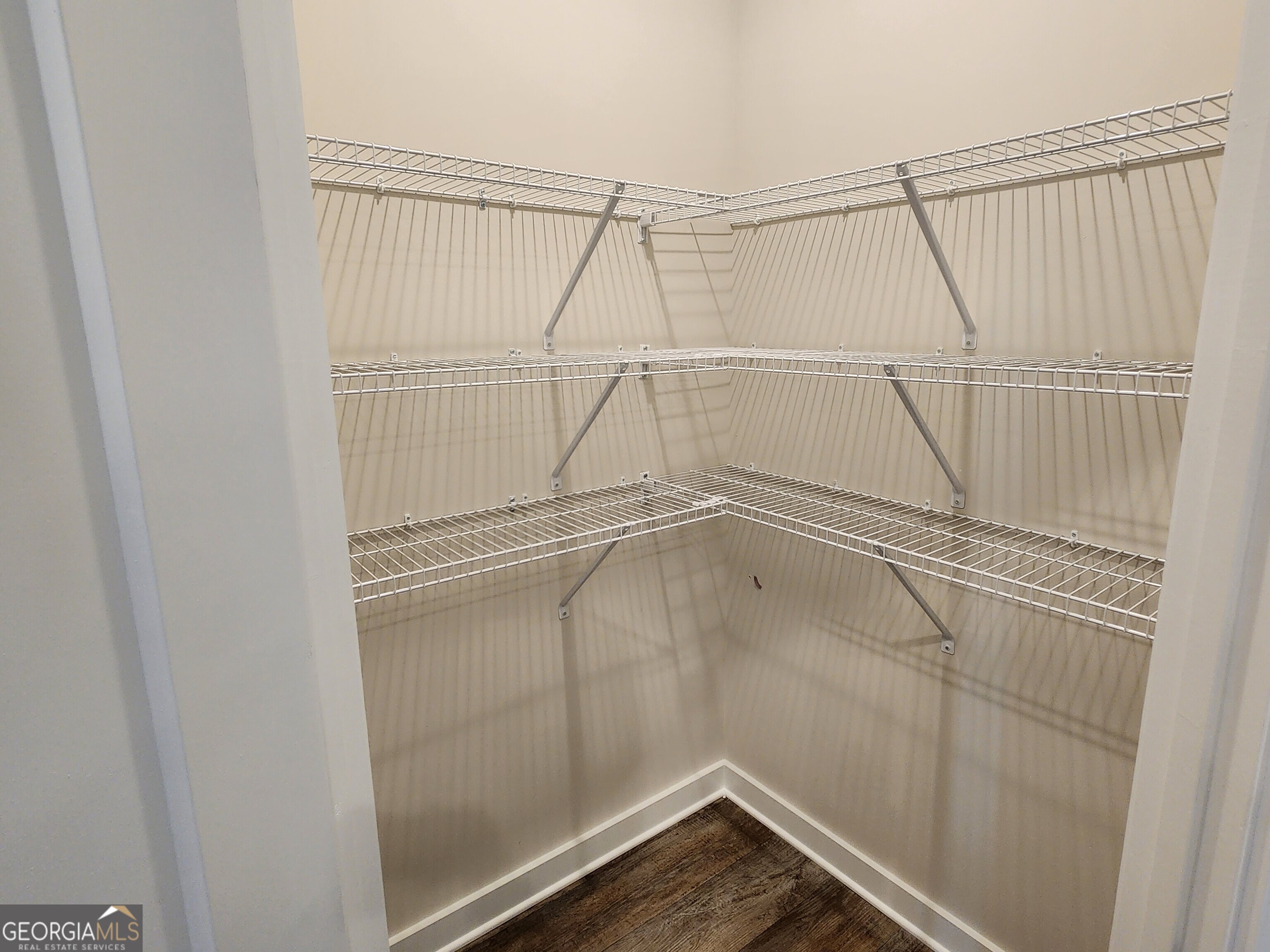 203 Crabapple Road, Unit 265 McDonough, GA 30253 - Photo 16 of 54 a view of a room with racks on the wall
