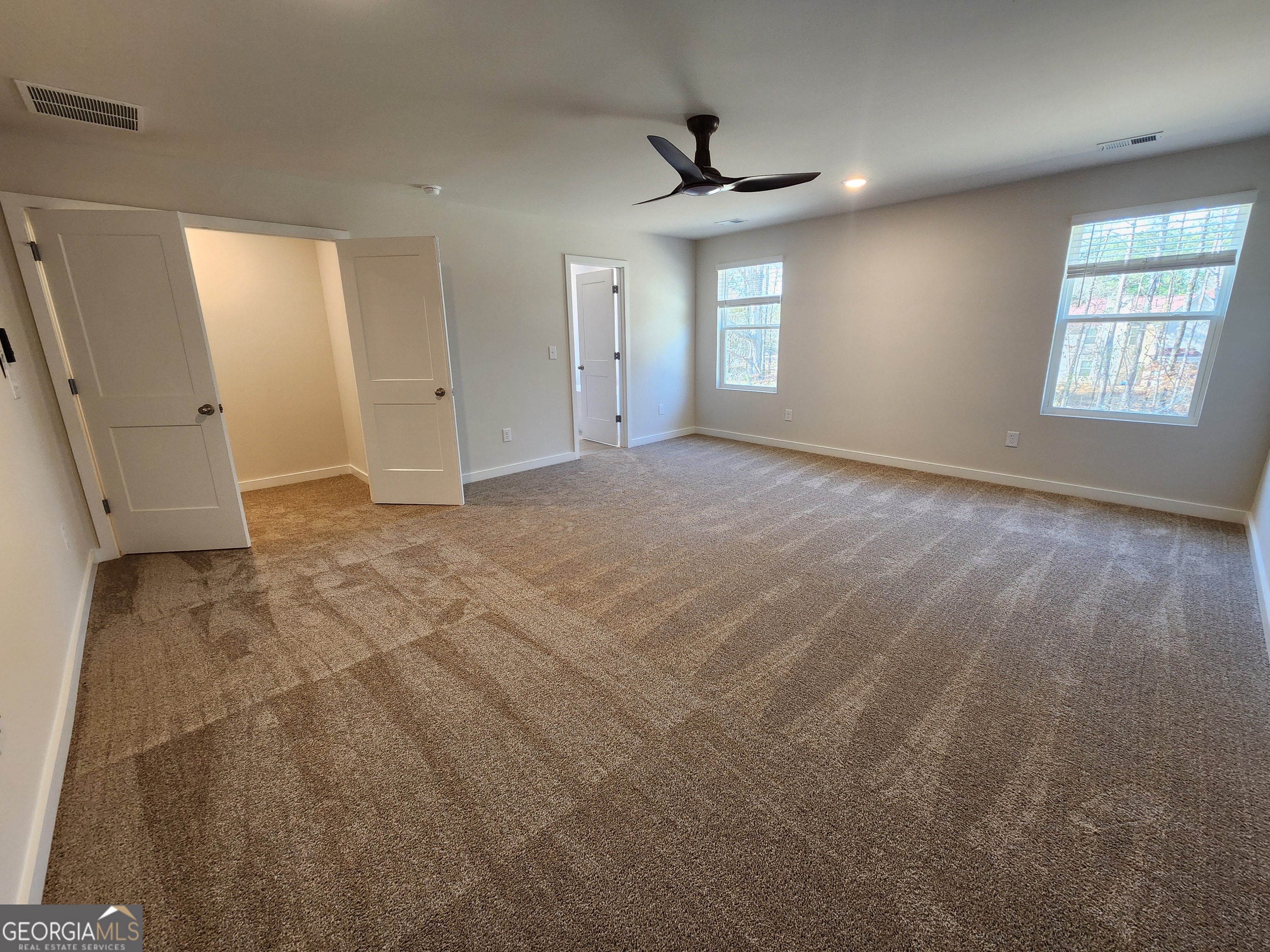 203 Crabapple Road, Unit 265 McDonough, GA 30253 - Photo 25 of 54 a view of an empty room with a window