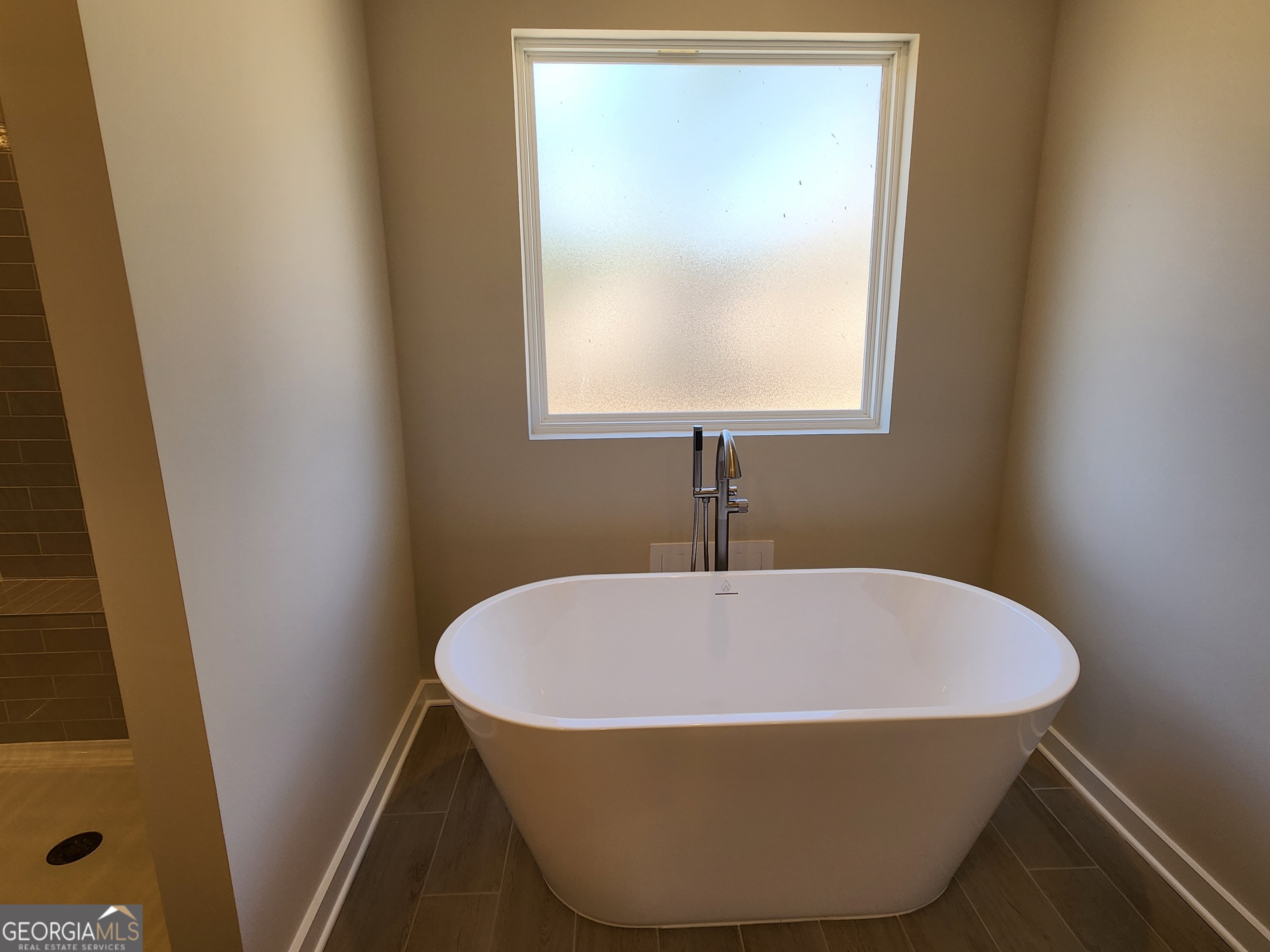 203 Crabapple Road, Unit 265 McDonough, GA 30253 - Photo 30 of 54 a view of a bathtub in a bathroom