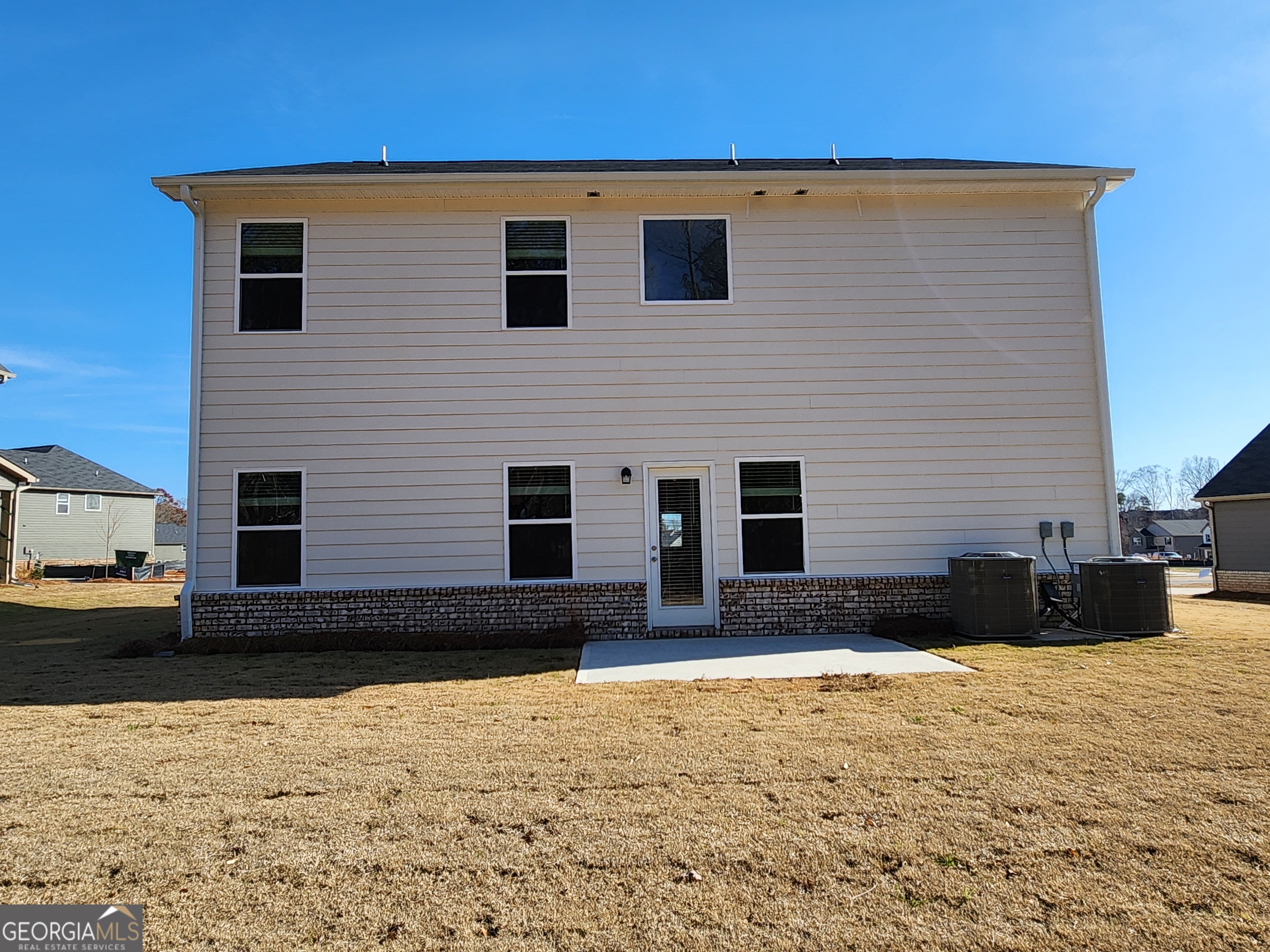 203 Crabapple Road, Unit 265 McDonough, GA 30253 - Photo 44 of 54 a view of a house with snow on the road