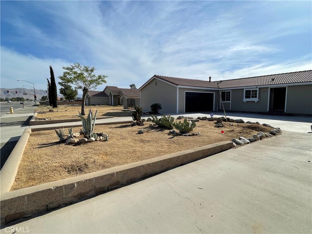 12546 Navajo Road Apple Valley, CA 92308 - Photo 25 of 27 Circular drive at front, and dedicated RV parking to the left of the house.