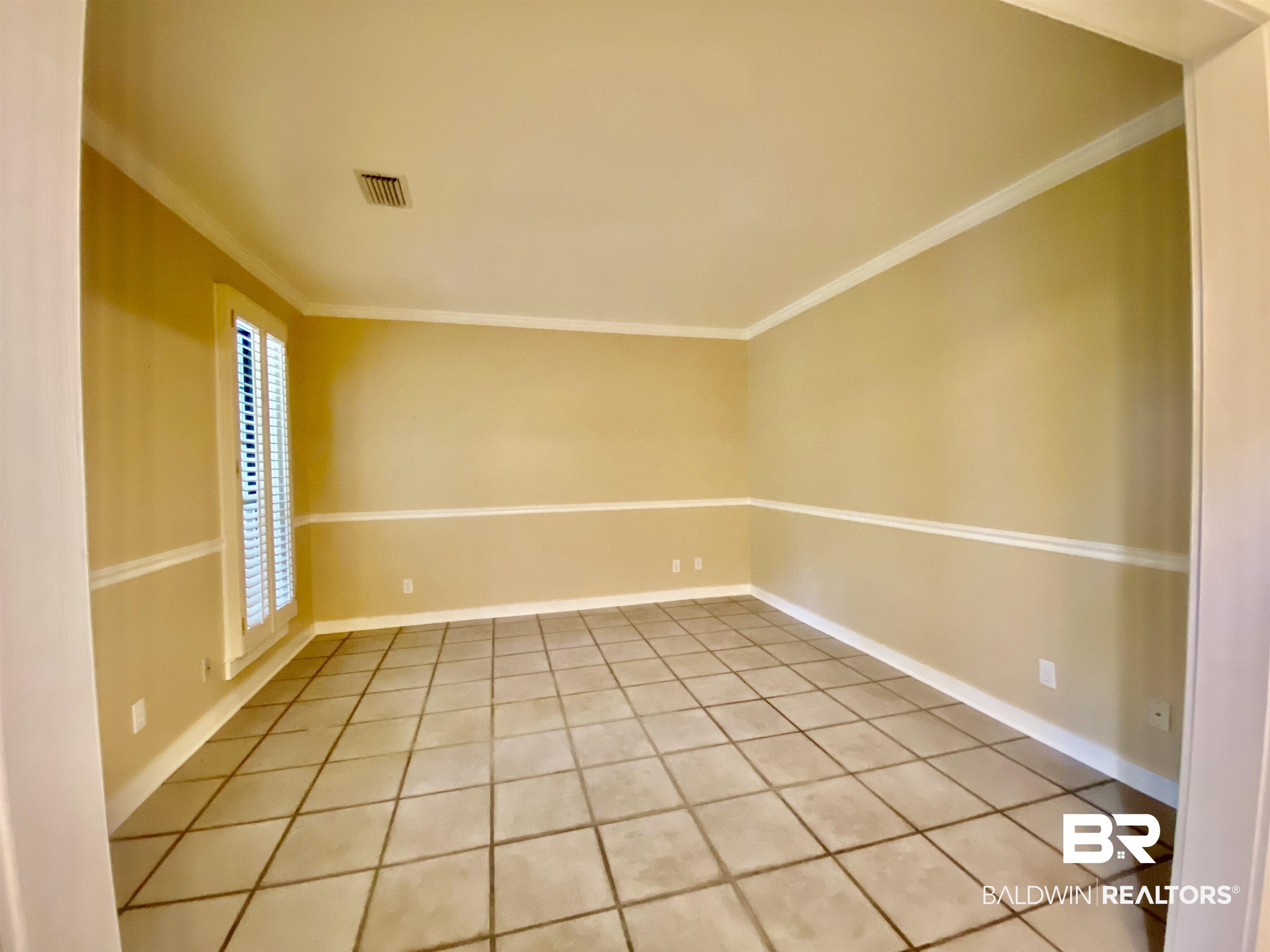 160 Mockingbird Lane Monroeville, AL 36460 - Photo 9 of 36 Empty room featuring ornamental molding and light tile patterned floors
