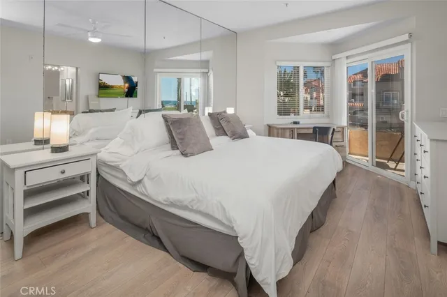 a bed room with a bed and a large window