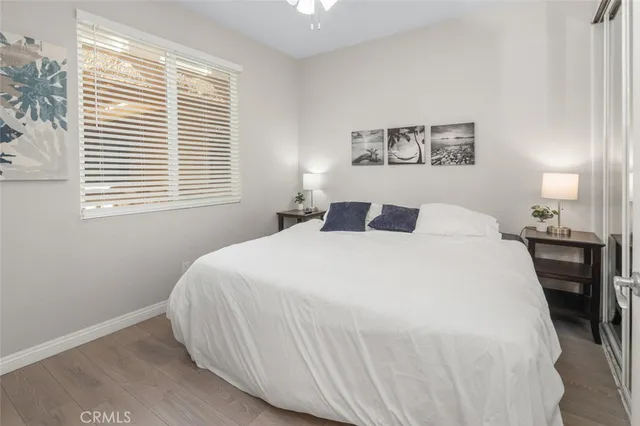 a bedroom with a large bed and a window