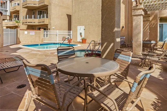 a terrace of a house with outdoor seating