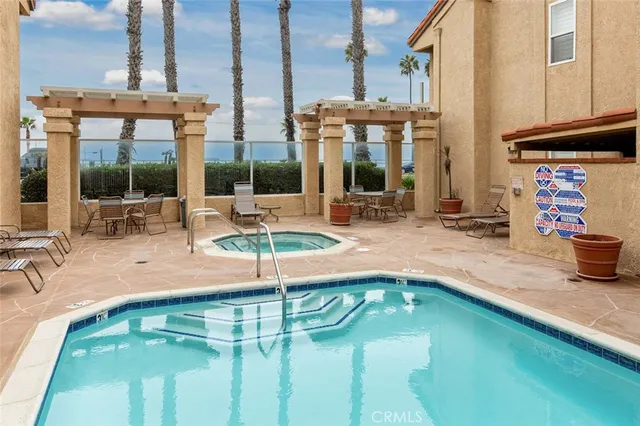 a swimming pool with outdoor seating