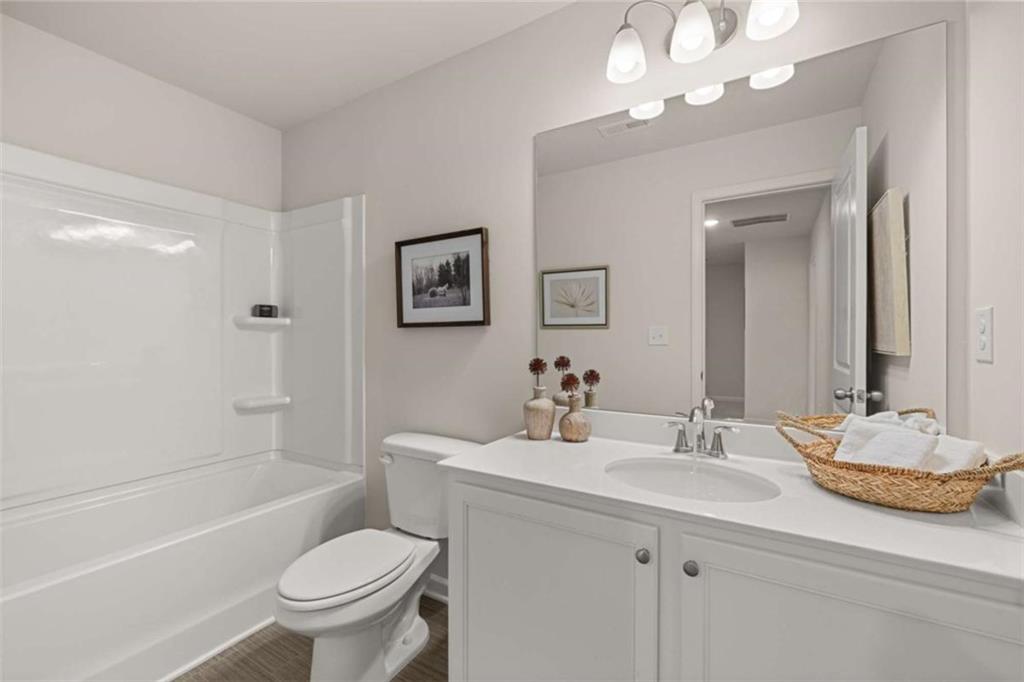 1039 Merritt Drive, Unit 92 Villa Rica, GA 30180 - Photo 35 of 47 a bathroom with a sink toilet tub and shower