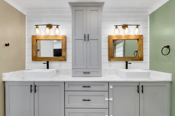 a bathroom with a sink and a mirror