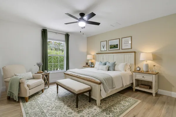 a bedroom with a bed and a couch