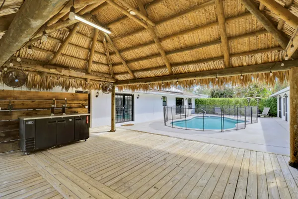 a view of a patio with wooden floor