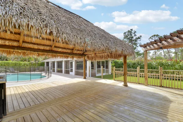 a view of a balcony with a yard