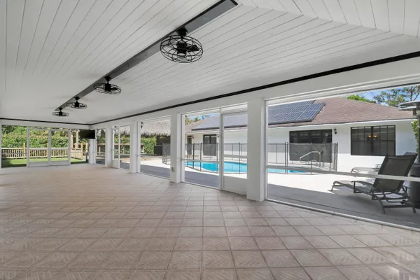 a view of an entryway with a floor to ceiling window
