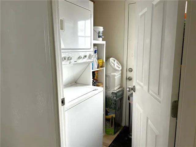 a bathroom with a tub sink shower and mirror