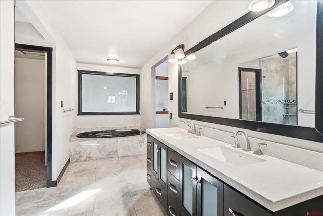 a bathroom with a shower and a sink