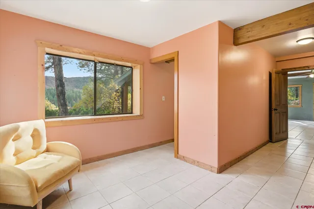 a view of balcony with wooden floor and fence