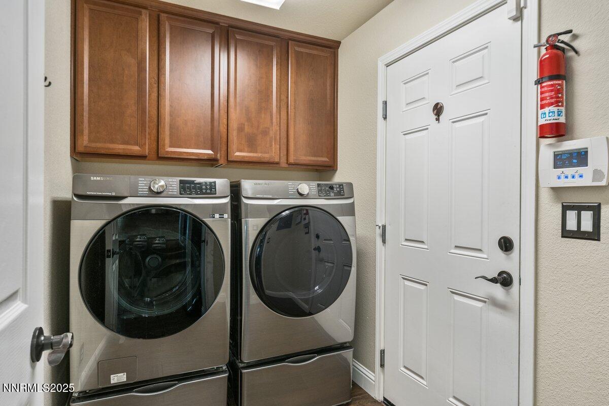 1955 Wind Ranch Road, Unit A Reno, NV 89521 - Photo 19 of 23 a utility room with dryer and washer