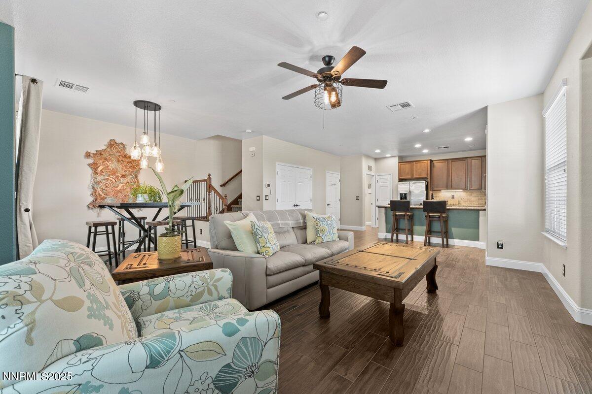 1955 Wind Ranch Road, Unit A Reno, NV 89521 - Photo 20 of 23 a living room with furniture and a wooden floor