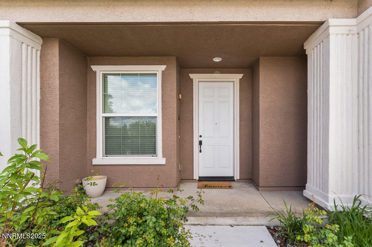 1955 Wind Ranch Road, Unit A Reno, NV 89521 - Photo 3 of 23 a front view of a house
