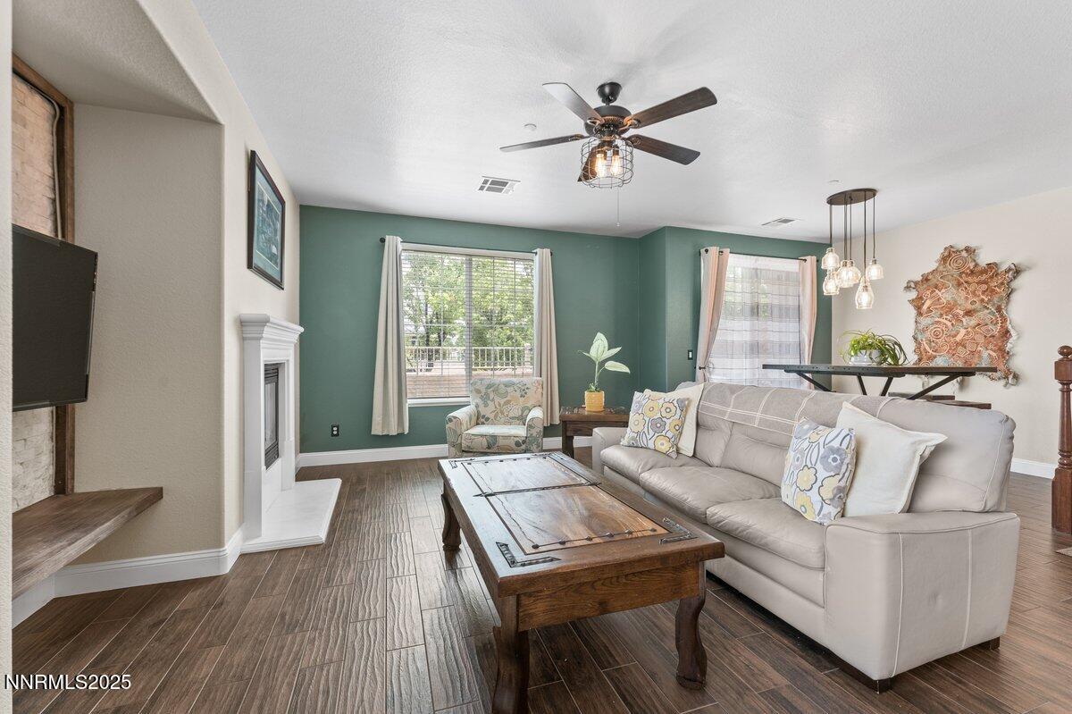 1955 Wind Ranch Road, Unit A Reno, NV 89521 - Photo 4 of 23 a living room with furniture and a flat screen tv