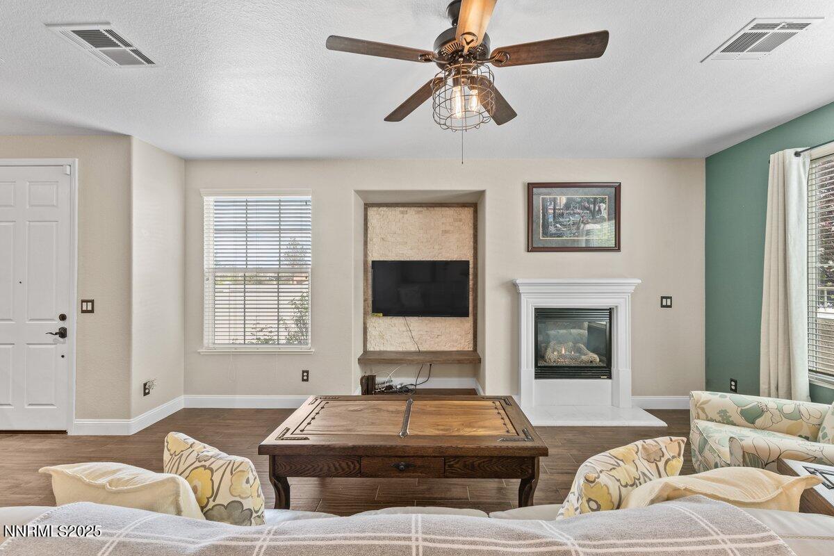 1955 Wind Ranch Road, Unit A Reno, NV 89521 - Photo 5 of 23 a living room with furniture and a fireplace