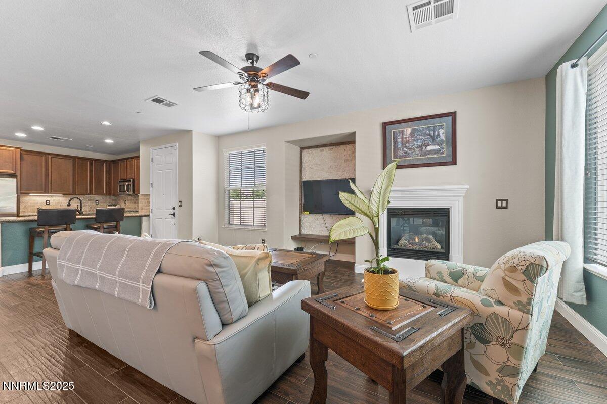 1955 Wind Ranch Road, Unit A Reno, NV 89521 - Photo 6 of 23 a living room with furniture and a fireplace