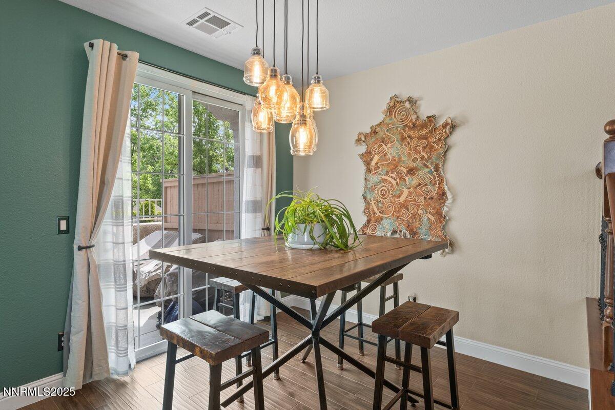 1955 Wind Ranch Road, Unit A Reno, NV 89521 - Photo 9 of 23 a view of a dining room with furniture window and outside view