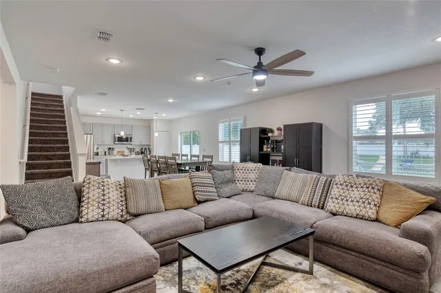 a view of a dining room with furniture and window