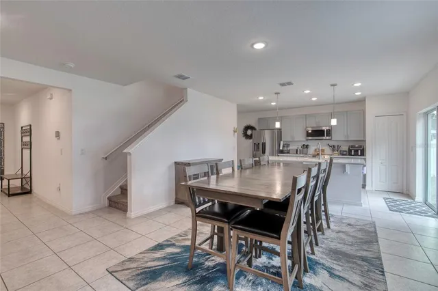 a kitchen with a sink a microwave a stove and cabinets
