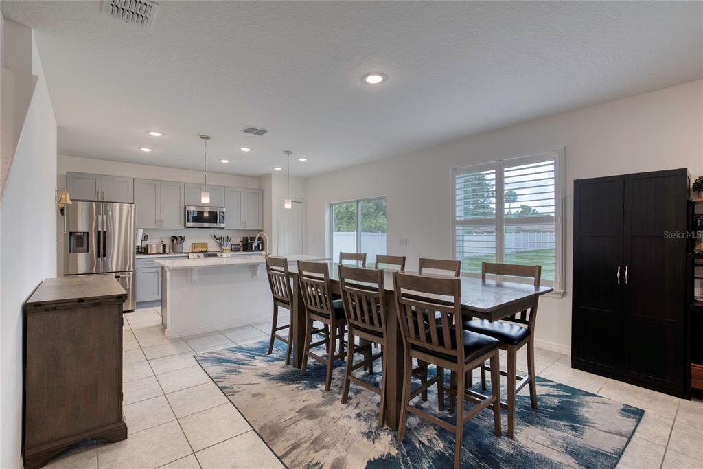 276 Farmbrook Road Port Orange, FL 32127 - Photo 19 of 62 a view of a dining room with furniture and window