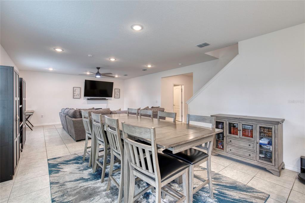 276 Farmbrook Road Port Orange, FL 32127 - Photo 24 of 62 a view of a dining room with furniture