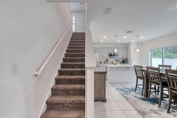 a bedroom with a bed and a chair
