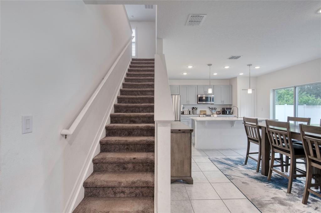 276 Farmbrook Road Port Orange, FL 32127 - Photo 25 of 62 a view of a dining room with furniture