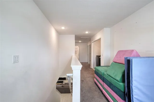 a bathroom with a granite countertop sink a toilet and a mirror
