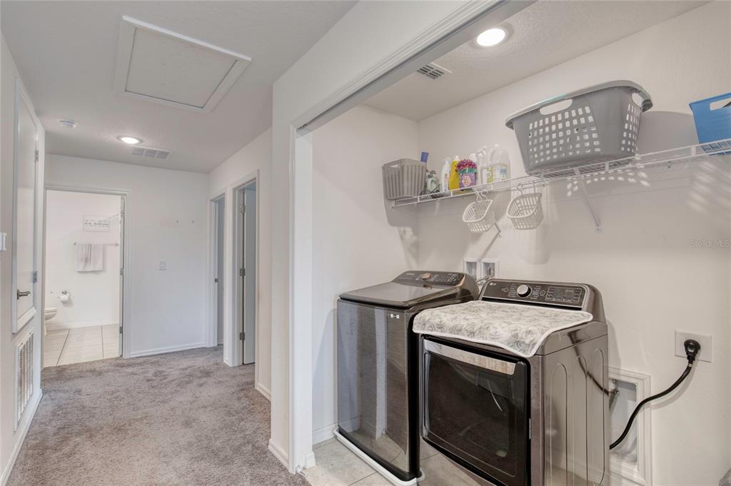 276 Farmbrook Road Port Orange, FL 32127 - Photo 27 of 62 a utility room with sink dryer and washer