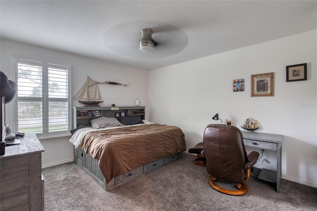 276 Farmbrook Road Port Orange, FL 32127 - Photo 28 of 62 a bedroom with a bed and a large window