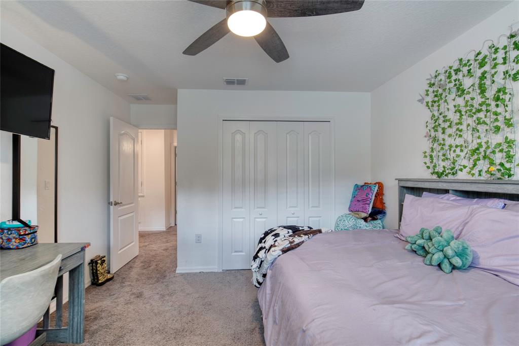 276 Farmbrook Road Port Orange, FL 32127 - Photo 34 of 62 a bed room with a bed and a chandelier