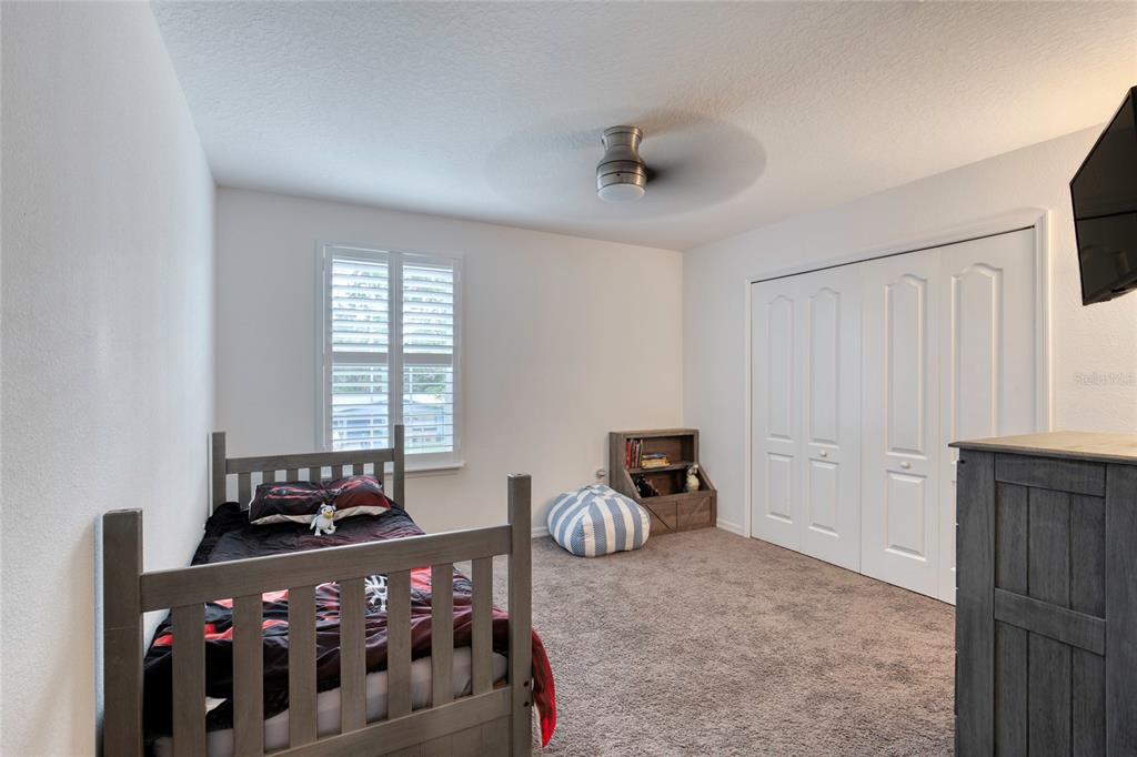 276 Farmbrook Road Port Orange, FL 32127 - Photo 35 of 62 a bedroom with furniture and a window